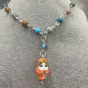 Orange Nesting Doll and Multi Stone Necklace